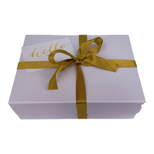 White keepsake box with gold ribbon